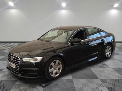 an image of a black audi parked on a checkered floor
