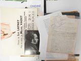a pile of books and papers sitting on a table