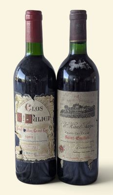 two bottles of wine that are sitting next to each other
