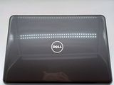 a dell laptop that is sitting on a table