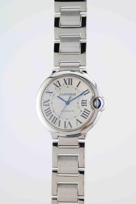 an image of a close up of a wrist watch with roman numerals