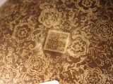 a close up of a decorative vase with a tag on it