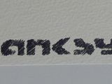 a close up of a sign on the side of a building