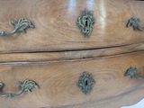 an image of a wooden dresser with brass hardware