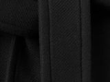 a close up of a black belted dress with buttons