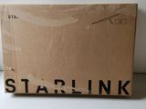 a box with a starlink logo on it sitting on a table