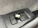 a car door handle with a piece of paper sticking out of it