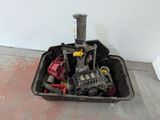 a black container filled with assorted items sitting on the floor
