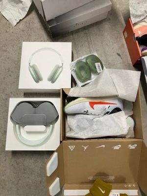 a box of headphones and a pair of shoes on the floor
