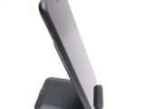 a cell phone that is sitting on top of a stand