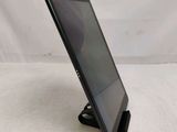 a close up of a tablet computer on a stand on a white surface