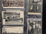 some old black and white photos of people and buildings on a table