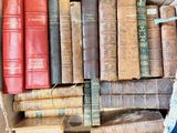 a box full of old books sitting on a table