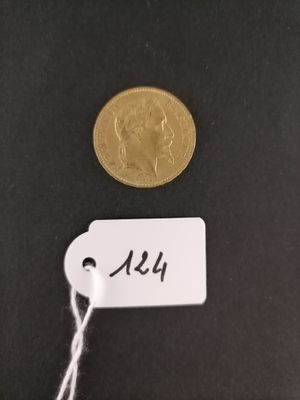 a close up of a coin with a tag attached to it