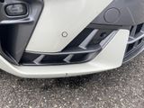 a close up of the front bumper of a white car