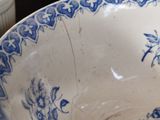 a blue and white bowl sitting on a table