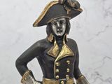 a statue of a man dressed in a pirate costume