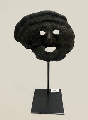 an image of a black mask on a black stand on a white background