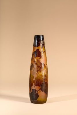 a vase that has a brown and black design on it