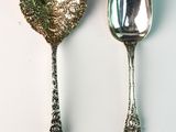 two spoons and a spoon on a white surface