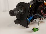 a close up of a motor with wires and wires attached to it