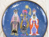 a blue plate with a picture of three wise men on it