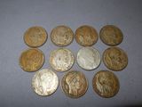 several different types of coins are arranged on a table