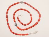 a red coral beaded necklace and bracelet set with silver accents