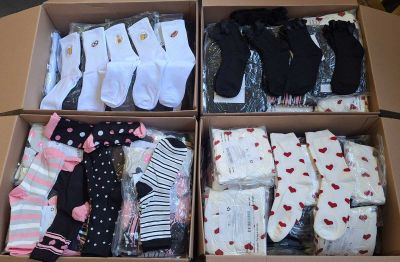 many pairs of socks in a box on a table