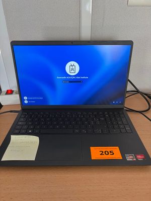 a laptop that is sitting on a desk with a price tag on it