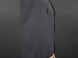 a blue uniform with gold stripes on a mannequin head