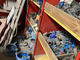 many different types of tools on the shelves in this room