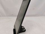 a tablet that is sitting on a stand on a table
