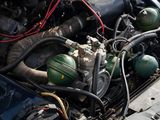 a close up of a car ' s engine with its hood open