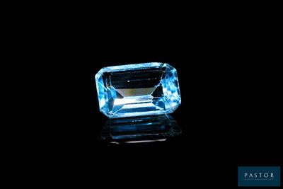 a blue topazte gems on a black background