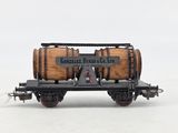 an image of a model train car with a barrel on the side