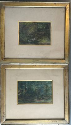 deux tableaux encadrés représentant des arbres et une rivière dans un cadre doré