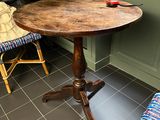 a small table that is in the corner of a room
