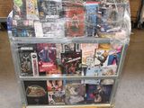 a cart full of dvds on the floor of a store