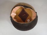 a brown hat with a brown label on it