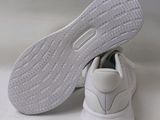 the sole of a pair of white shoes on a white surface