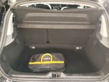 a bag in the trunk of a car that is packed with luggage