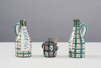 three vases sitting next to each other on a table