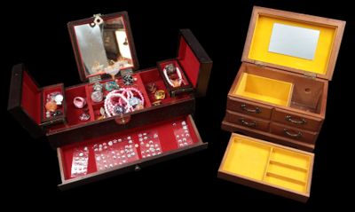 two wooden boxes with dice and mirrors in them