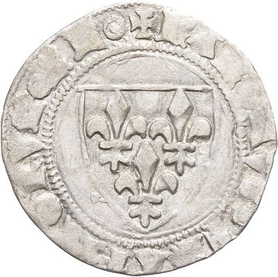 a close up of a coin with a crown on it