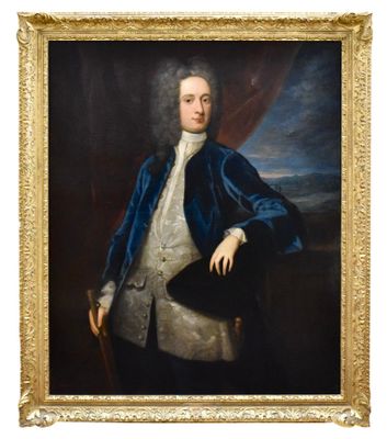 portrait d'un homme vêtu d'une veste bleue et d'une chemise blanche