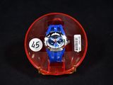 a blue and red watch sitting in a red case
