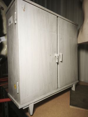 a cabinet that is sitting on top of a table
