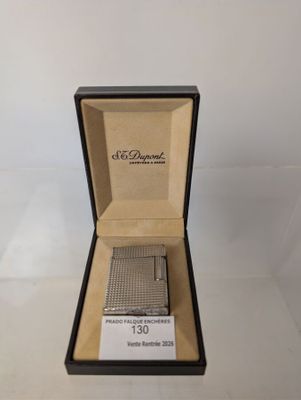 an open box with a lighter inside of it on a table
