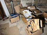 a pile of boxes that are sitting on the floor